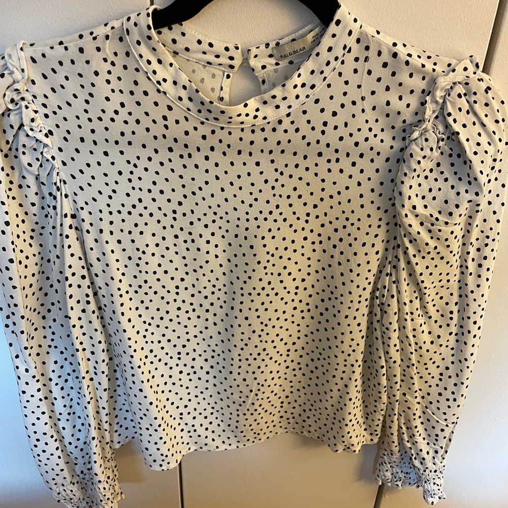 White polka dotted blouse